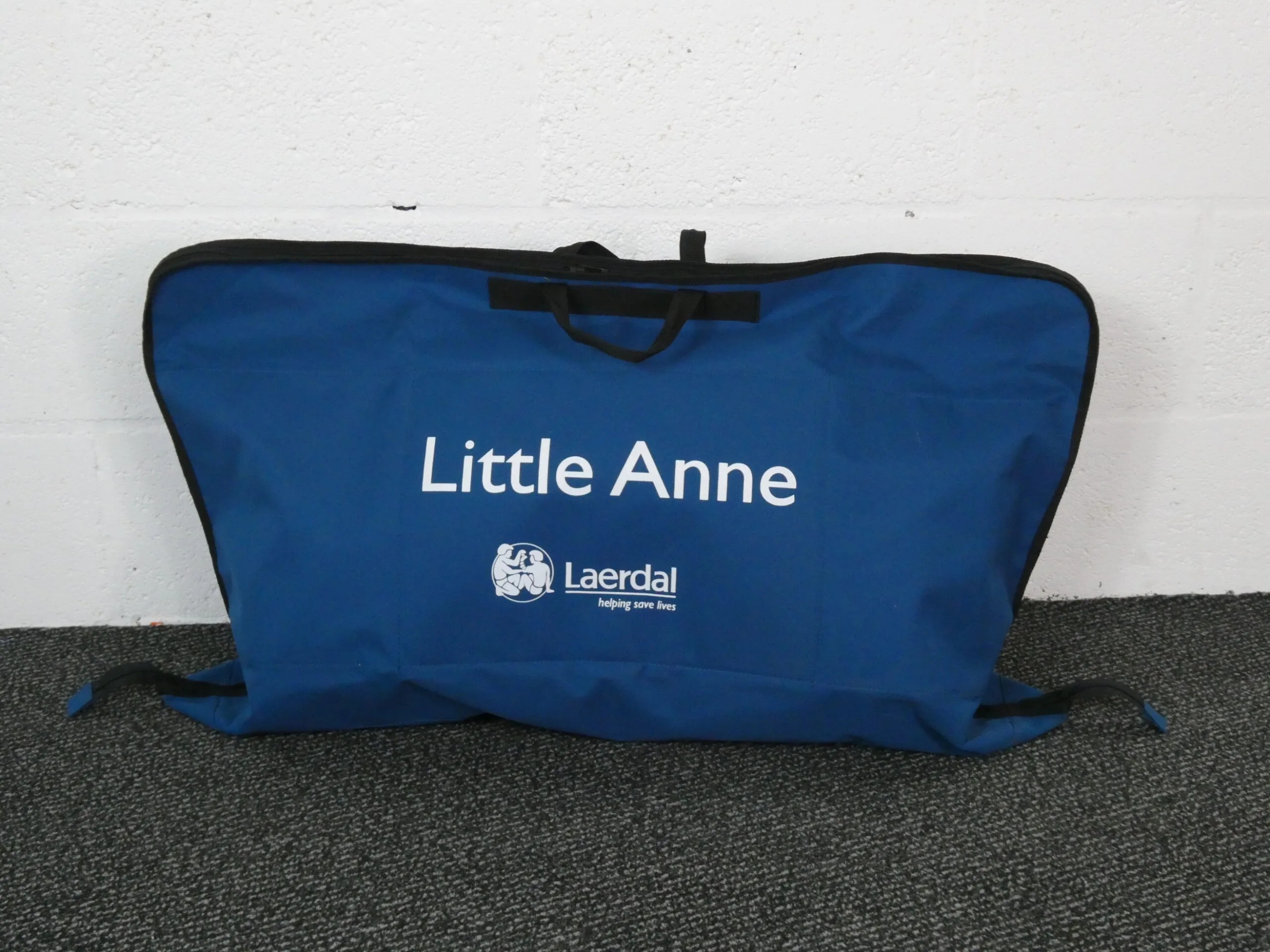CPR training manikin in its carry bag